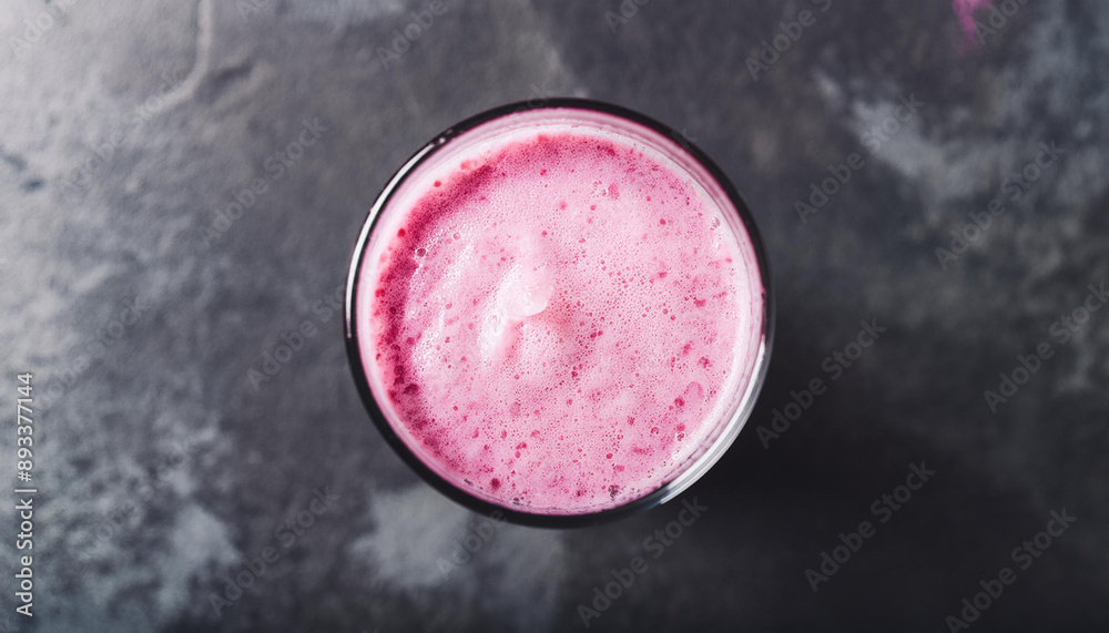 Pink smoothie on dark stone table. Healthy and tasty beverage. Fruit milk shake. Organic detox drink Pink smoothie on dark stone table. Healthy and tasty beverage. Fruit milk shake. Organic detox drink