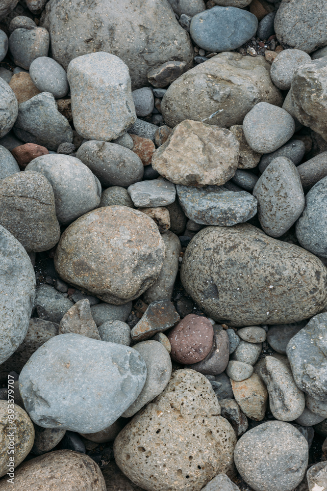 Abstract smooth round pebbles sea texture background. Stones in Faroe island Abstract smooth round pebbles sea texture background. Stones in Faroe island