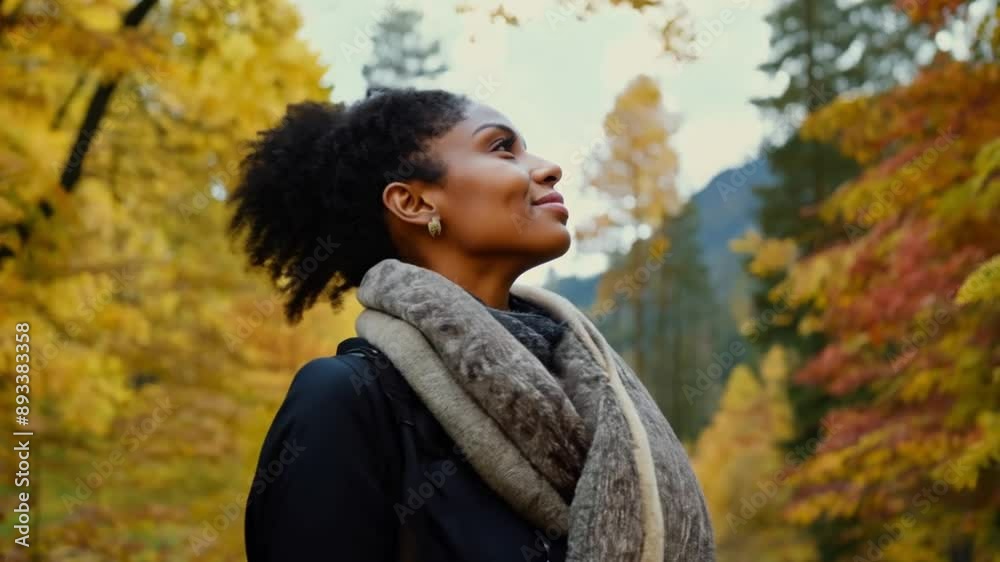 Happy smiling young Woman enjoying in autumn sunny day among tree leaves in the park. African American female in fall nature on sunny day 4k video Happy smiling young Woman enjoying in autumn sunny day among tree leaves in the park. African American female in fall nature on sunny day 4k video