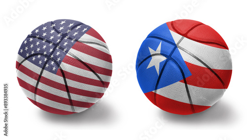 basketball balls with the national flags of puerto rico and united states of america on the white background. photo