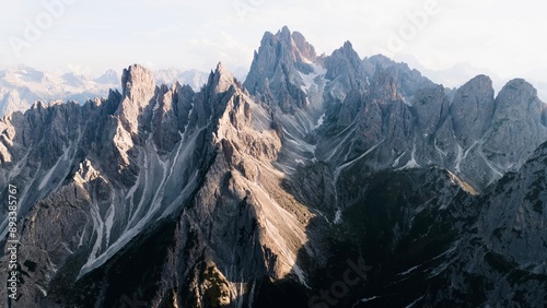Photos Landscapes of epic mountains during the sunset surrounded by clouds, with warm and cold lights