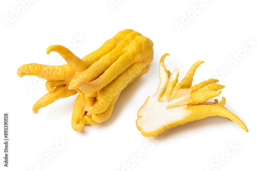 Whole and halved  ripe Buddha's fingers, citrus medica, isolated on white background close up photo