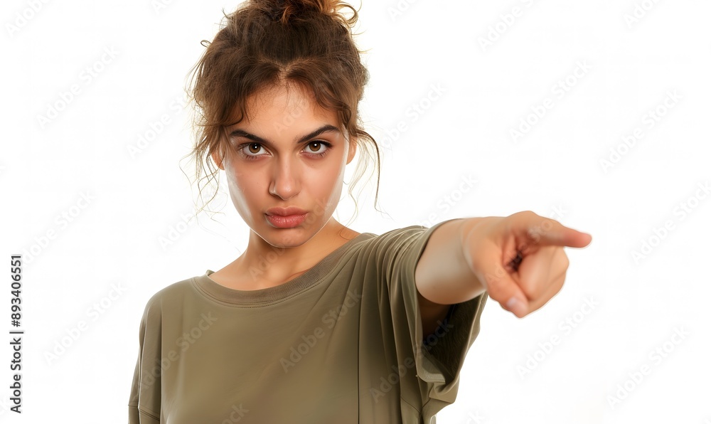 woman with determined look, pointing confidently forward with one hand in isolated white background woman with determined look, pointing confidently forward with one hand in isolated white background