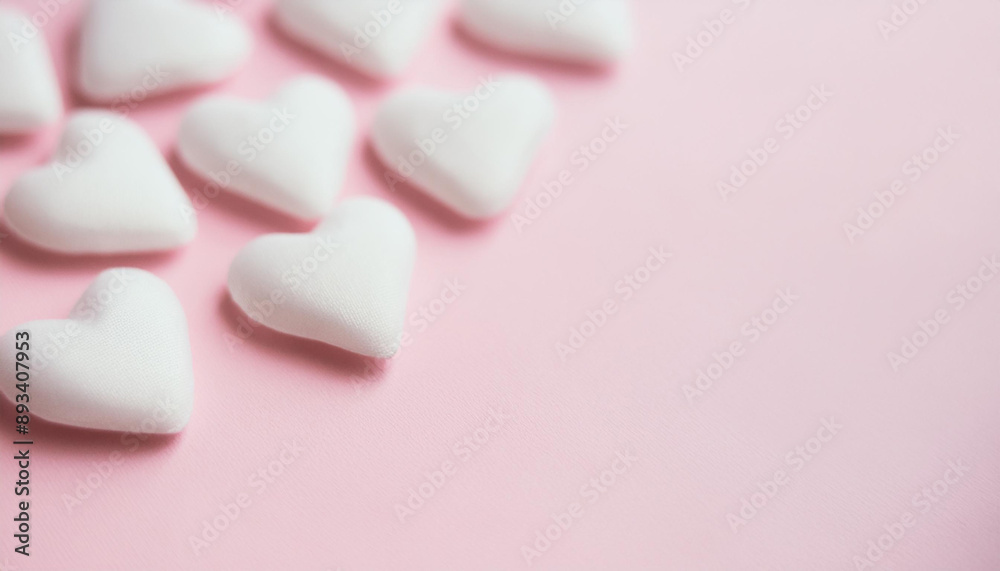 White hearts on isolated pink. Valentine's Day holiday. Love and romantic concept. Close-up. White hearts on isolated pink. Valentine's Day holiday. Love and romantic concept. Close-up.