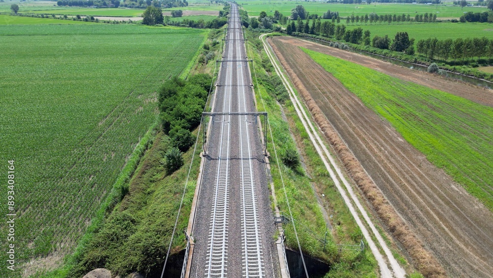 Europe, Italy , Milan - Frecciarossa Hight speed 300km h train railway from Milan to Rome view from the drone - the faster way to travel in Italy for tourist and passengers - tourist destination