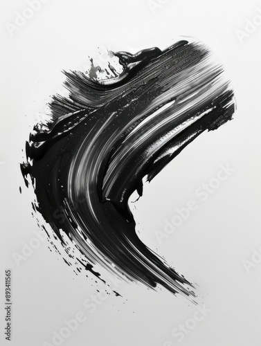 A close-up shot of a single brush stroke in black and white, with details of the brush marks