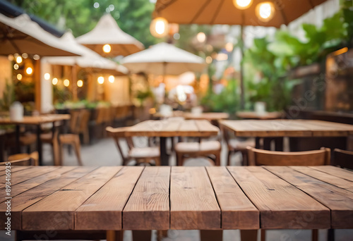 An inviting outdoor cafe setting with a warm wooden table in the foreground and blurred patrons enjoying their time in the background. Perfect for food blogs, restaurant websites, travel articles, or 