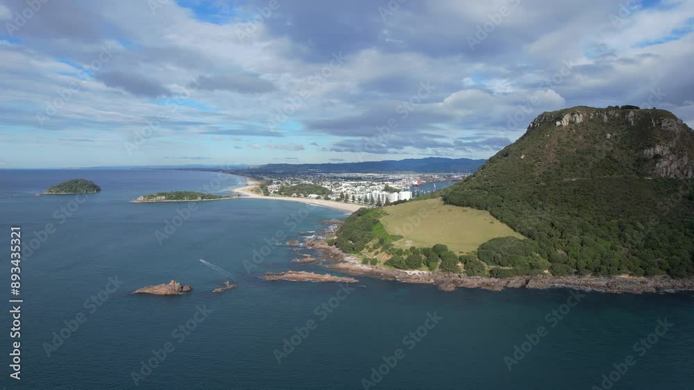 Mount Maunganui Against Cloudy Sky In Tauranga, New Zealand - Aerial Drone Shot Mount Maunganui Against Cloudy Sky In Tauranga, New Zealand - Aerial Drone Shot