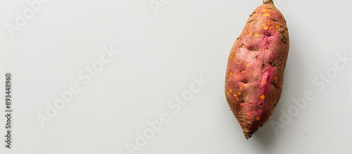 A sweet potato on a clear w...