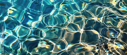 Crystal clear water in a pool reflecting light perfectly ideal for a copy space image