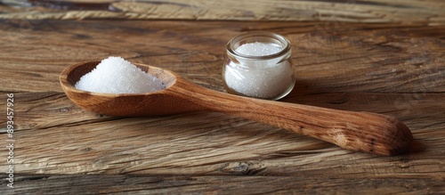 Wooden spoon and sugar jar ...