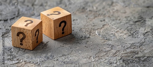 Three wooden cubes with que...