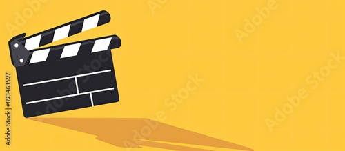 Minimalistic concept for cinema with yellow background featuring a clapper board, suitable for a screenwriter's desktop with copy space image. photo