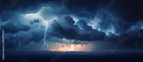 Dark blue sky overlaid with an imposing rising thunderhead cloud formation, creating a dramatic scene with a copy space image.