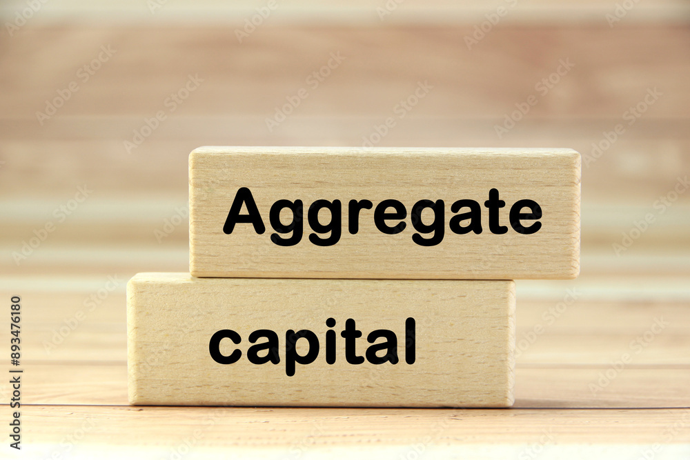 aggregate capital Short word english letter or text on wood block with brown background.Copy space concept and selection focus. aggregate capital Short word english letter or text on wood block with brown background.Copy space concept and selection focus.