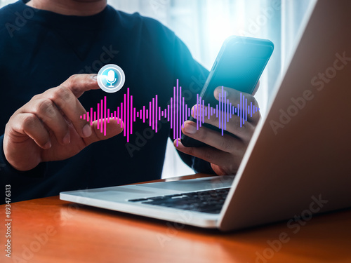 Wallpaper Mural Conversation voice search application technology concept. AI conversational assistant automation bot with digital sound wave audio graphic on smartphone while man press on virtual microphone button. Torontodigital.ca