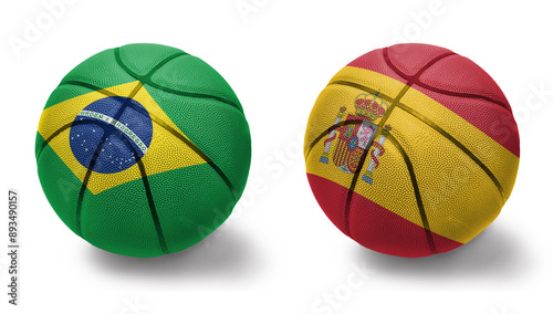 basketball balls with the national flags of spain and brazil on the white background.