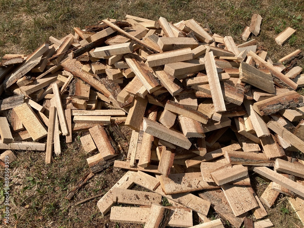 Chopping and sawing firewood from slats Chopping and sawing firewood from slats
