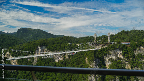 Glass bridge of Zhangjiajie China Tianzishan with blue sky, Zhangjiajie national forest park, China, concept of world heritage, avatar, heritage peak or cliff mountain, tourist attraction famous place