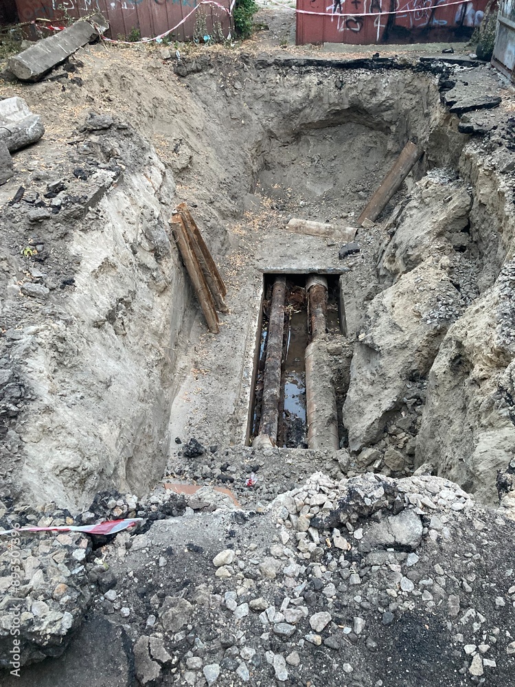Obraz premium Excavated pit repair of water pipes