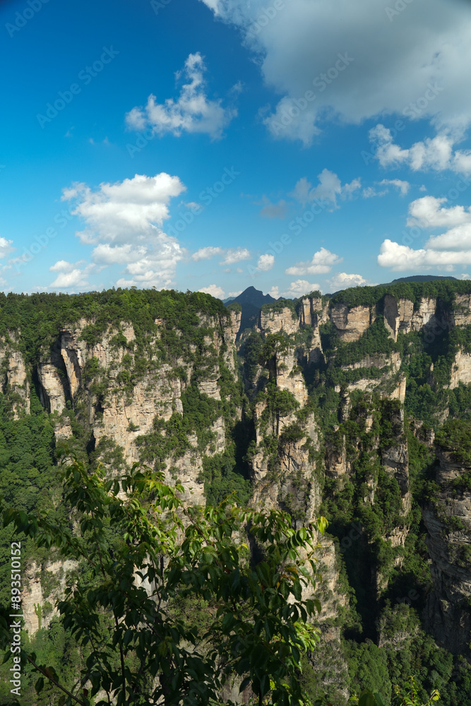 Fototapeta premium Zhangjiajie national forest park, China, Glass bridge of Zhangjiajie China Tianzishan with blue sky, concept of world heritage, avatar, heritage peak or cliff mountain, tourist attraction famous place