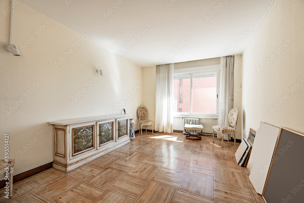 Fototapeta premium velvet sofa, classic wingback chairs, a carved wooden coffee table