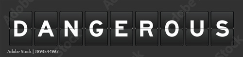 Black color analog flip board with word dangerous on gray background