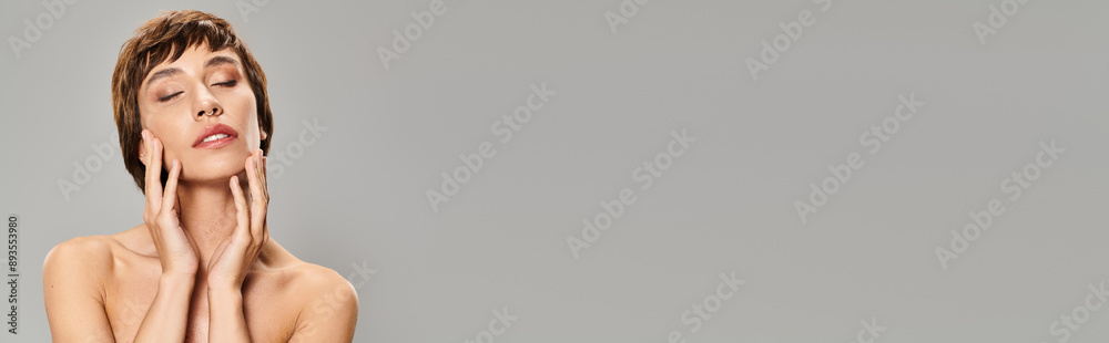 Young woman with hands on face.