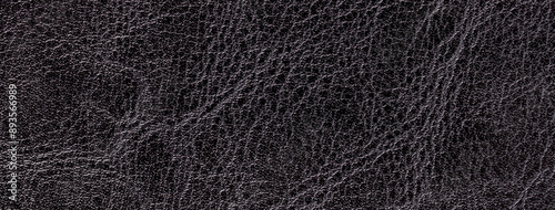 Lacquered black leather texture background with pattern, macro. Structure of textile backdrop photo