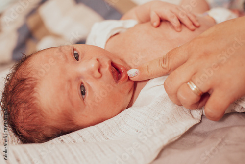 The examination of newborn baby mouth, frenulum of the tongue