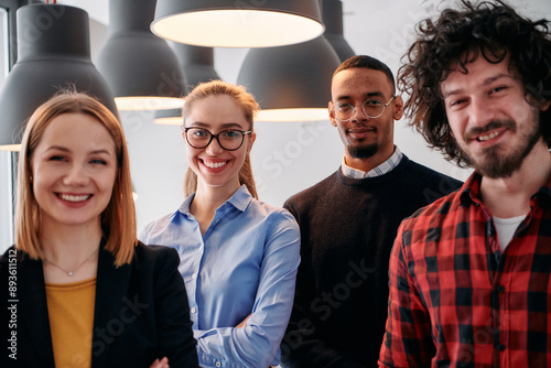 Diverse Business Team Standing United in Modern Office Ready for New Challenges. photo