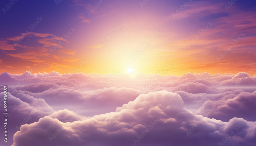 The sun rising over the clouds in the sky