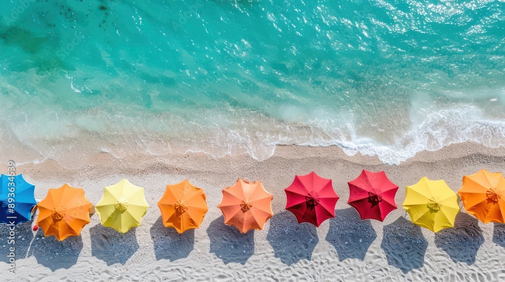 A colorful array of beach umbrellas dotting a sandy shore, The sky is bright and clear, with the sun shining brightly A colorful array of beach umbrellas dotting a sandy shore, The sky is bright and clear, with the sun shining brightly