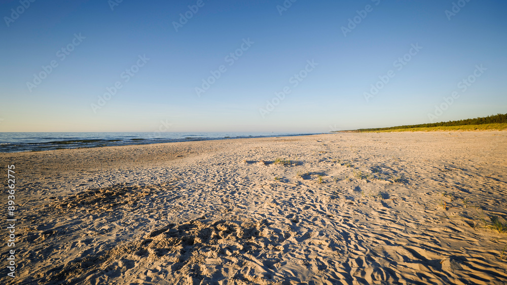 A wonderful wide, fine sand beach in the afternoon sun. Baltic Sea, Slajszewo, Poland