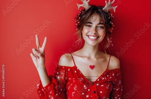 Smiling Woman in Santa Hat Holding Shopping Bags
