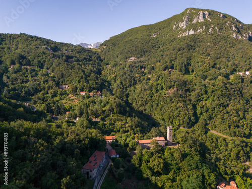 Sant'Anna di Stazzema, Italy : the Memorial Ossuary monument to the victims of the Nazi-fascist massacre and Apuan Alps view