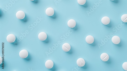 Top view of seamless arrangement of round white medical pills on blue surface