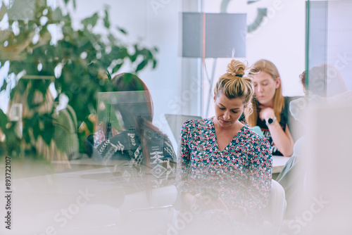 Business Team of Women Discussing New Topics and Strategies to Improve Client Operations. photo