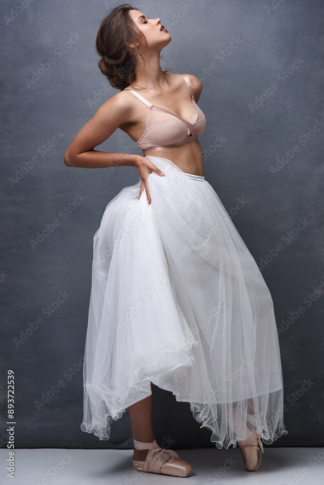 Fototapeta premium Woman, profile and ballet dancer with makeup, beauty or underwear for art, fashion or elegance on a wall background. Attractive female person, young model or performer with confidence, bra and skirt