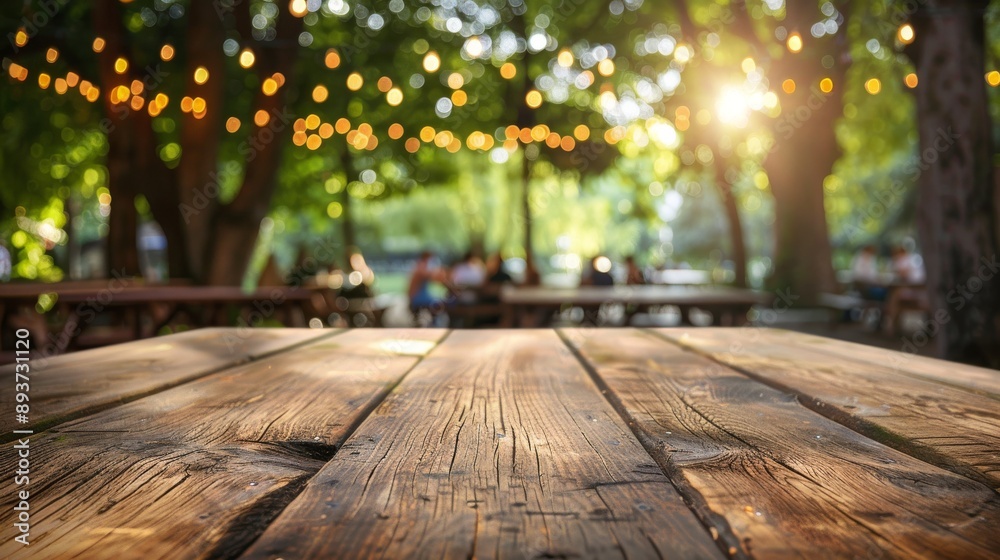A wooden table top with a blurred background of a summer park scene