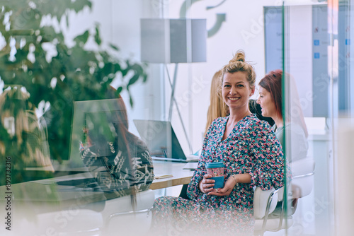 Business Team of Women Discussing New Topics and Strategies to Improve Client Operations. photo