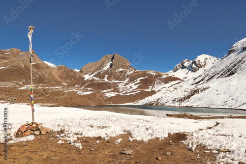 The Ice Lake, Kicho Tal, Khicho Ice Lake on a sunny day, close to Manang, Annapurna Circuit Trek, Nepal photo