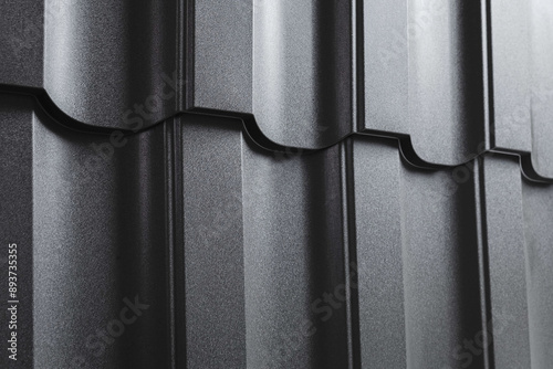 Close-up view lightweight galvanised steel roofing sheet. Modular tile effect roof panel. Traditional metal shingle tiles. Popular profiled metallic pantile mimic clay or concrete slate