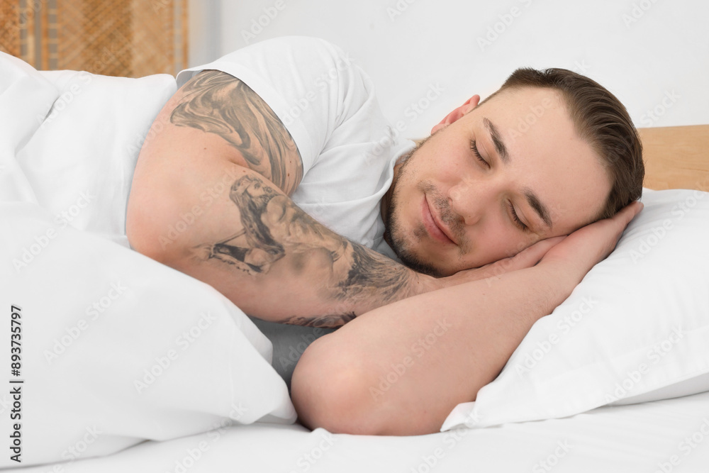 Bedtime. Handsome man sleeping in bed indoors Bedtime. Handsome man sleeping in bed indoors