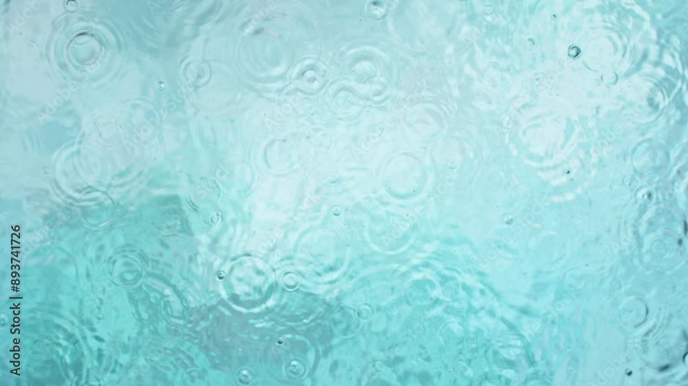 Slow motion of splashing water on light blue background , filmed on high speed cinematic camera at 1000 FPS Slow motion of splashing water on light blue background , filmed on high speed cinematic camera at 1000 FPS