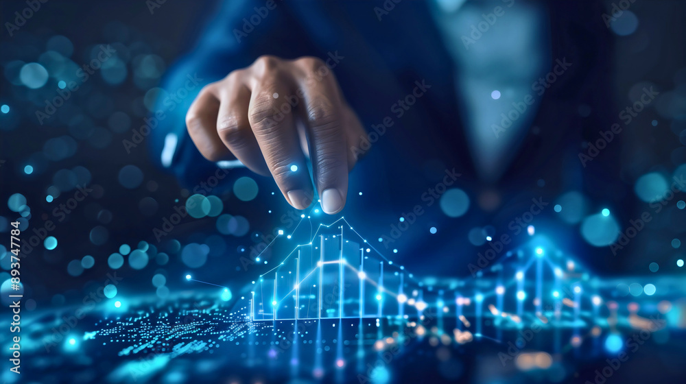 © Stefan - Businessman touching 3D blue futuristic holographic charts or graphs with growth and declines financial analytic investment displayed on high technology hologram, money statistic digital stock market.