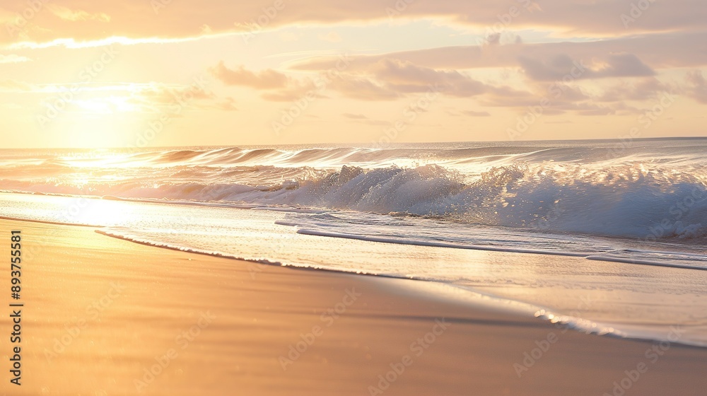 Obraz premium Gentle Waves Crashing on Sandy Beach at Sunrise