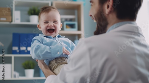 The doctor holding baby photo