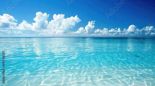 Tranquil Blue Ocean Waters With White Clouds On A Sunny Day