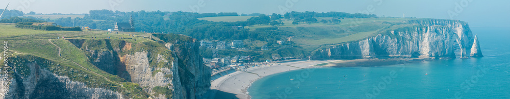 Aerial view of Etretat cliffs and the Atlantic ocean. Chalk cliffs and three natural arches. Panoramic path to admire the coast. Normandy region of Northwestern France. 06-26-2024 Aerial view of Etretat cliffs and the Atlantic ocean. Chalk cliffs and three natural arches. Panoramic path to admire the coast. Normandy region of Northwestern France. 06-26-2024